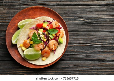 Plate With Delicious Shrimp Taco On Wooden Table