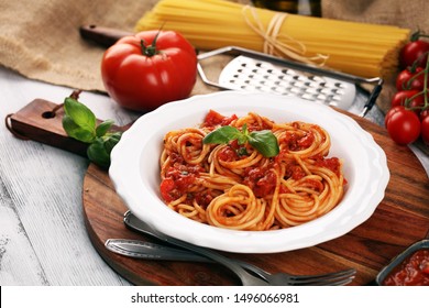 Plate of delicious spaghetti Bolognaise or Bolognese with savory minced beef and tomato sauce garnished with parmesan cheese