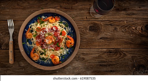 Plate Of Delicious Spaghetti With Shrimps And Parmesan Cheese, Overhead View