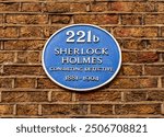 Plate with detective Sherlock Holmes name on Baker street 221b, London, UK
