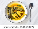 a plate of fish soup