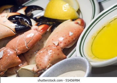 plate of florida stone crab claws with lemon butter and mustard as photographed in south beach miami florida