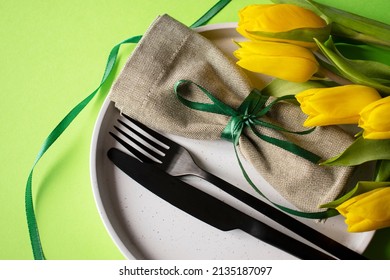 Plate Fork And Knife With Holiday Napkin And Tulips