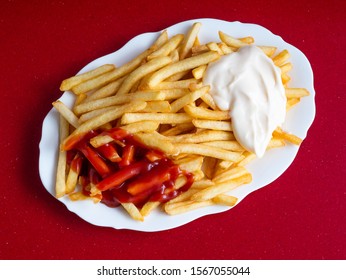 Plate With Frech Fries And Ketchup And Mayonaise