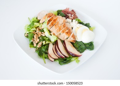 Plate Of Fresh Chopped Grilled Chicken Salad On A White Background