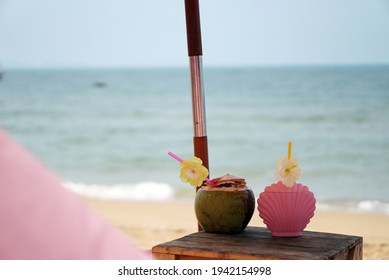 Plate Fresh Coconut And Shell Sand Art Bottle On  Table Beach.