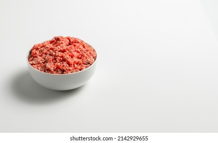 Plate With Fresh Ground Beef On A White Background, Space For Text, Stock Photo