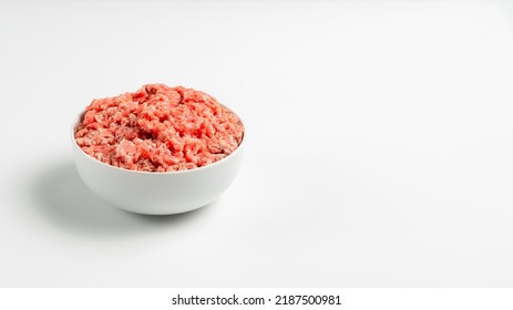 Plate With Fresh Ground Beef On A White Background, Space For Text