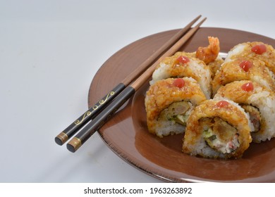 Plate Of Fresh Shrimp Tempura Sushi Roll On Plain Background