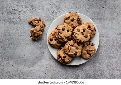 Plate of freshly baked chocolate chip cookies shot from above. - Shutterstock ID 1748385806