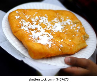 A Plate Of Fried Dough At A Local Carnival