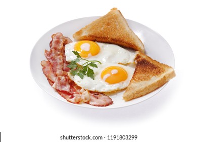 plate of fried eggs, bacon and toast isolated on white background
