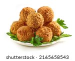 plate of fried falafel balls and parsley leaves isolated on white background