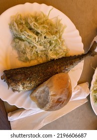 Plate With A Fried Fish And Coleslaw