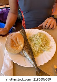 Plate With A Fried Fish And Coleslaw