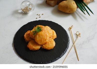 A Plate Of Fried Potato Cake Or Perkedel Kentang Against White Background