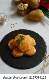 A Plate Of Fried Potato Cake Or Perkedel Kentang Against White Background