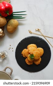 A Plate Of Fried Potato Cake Or Perkedel Kentang Against White Background