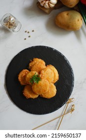 A Plate Of Fried Potato Cake Or Perkedel Kentang Against White Background