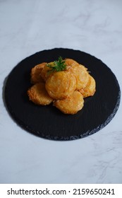 A Plate Of Fried Potato Cake Or Perkedel Kentang Against White Background