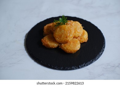 A Plate Of Fried Potato Cake Or Perkedel Kentang Against White Background