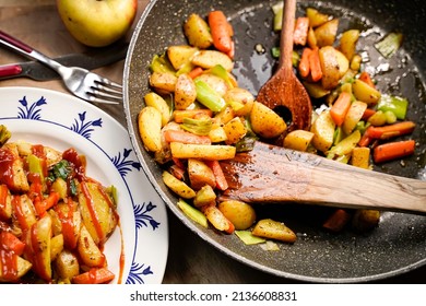 A Plate Of Fried Potatoes With Curry Ketchup.