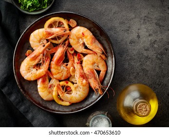plate of fried prawns on dark table, top view - Powered by Shutterstock