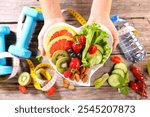 plate of  fruits and vegetables presenting in hand. fitness food, healthy eating, weight loss, dieting concept