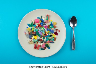 Plate full of microplastics. Plastic pollution concept.