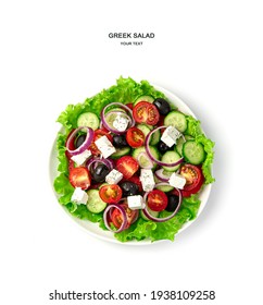 A Plate Of Greek Salad On A White Background. Top View. The Concept Of Proper Nutrition.