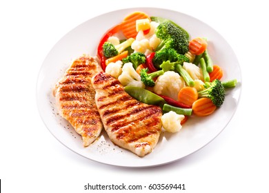 Plate Of Grilled Chicken With Vegetables Isolated On White Background