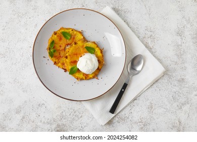 Plate with grilled pineapple slices and ice cream on light background - Powered by Shutterstock