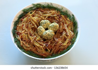 Plate Of Grouse Nest Salad On A Blue Background