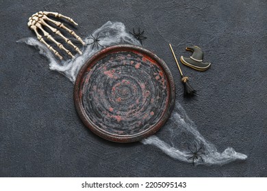 Plate And Halloween Decor On Black Background