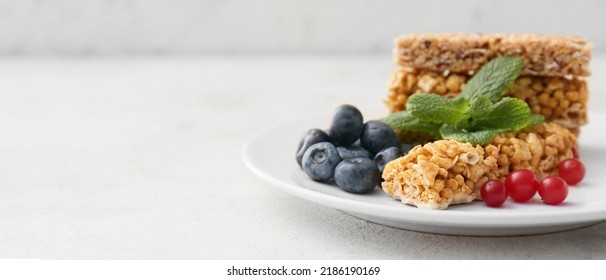 Plate With Healthy Cereal Bars And Berries On Light Background With Space For Text