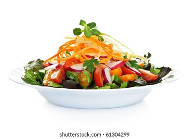 Plate of healthy green garden salad with fresh vegetables on white background