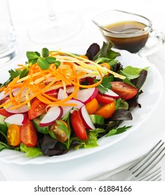 Plate Of Healthy Green Garden Salad With Fresh Vegetables Served With Balsamic Dressing