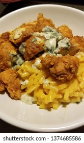 Plate Of Homemade Buffalo Chicken Tenders And Mac Dinner