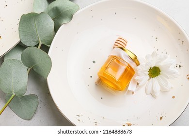 Plate with honey bonbonniere on white background - Shutterstock ID 2164888673