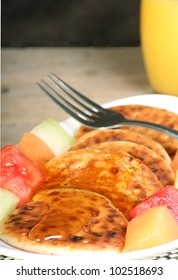 Plate Of Hot Scotch Pancakes With Honey And Melon