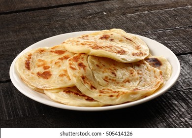 Plate Of Indian Food Paratha.