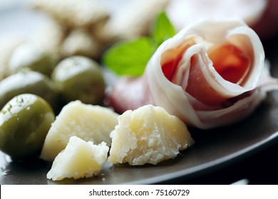 Plate Of Italian Foods Like Parma Ham And Parmesan Cheese