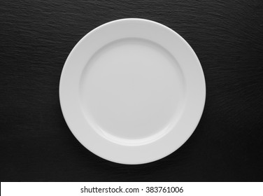 plate, knife and fork on table background