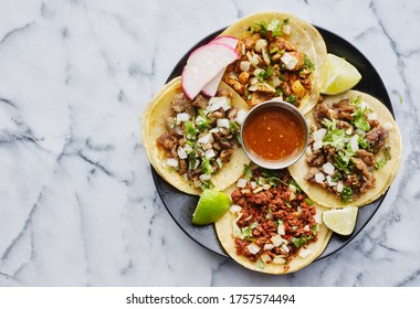 plate of mexican street tacos in copy space composition