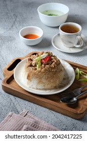 A Plate Of Nasi Tim On A Wooden Tray. Savory Soft Steamed Rice