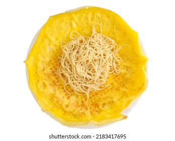 A Plate Of Omelet With Plain Spaghetti On Top