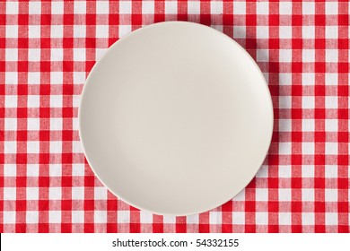 The Plate On Checkered Table Cloth