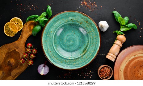 A plate on a wooden table. Table service concept. On a wooden background. Top view. Free copy space.