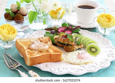 Plate Of Peanut Butter Toast,fried Egg,stuffed Zucchini, And Turnip Kiwi Carpaccio