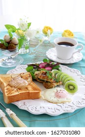 Plate Of Peanut Butter Toast,fried Egg,stuffed Zucchini, And Turnip Kiwi Carpaccio